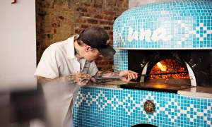 Man using a pizza oven