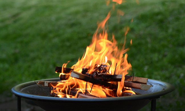 Fire pit burning wood on a patio