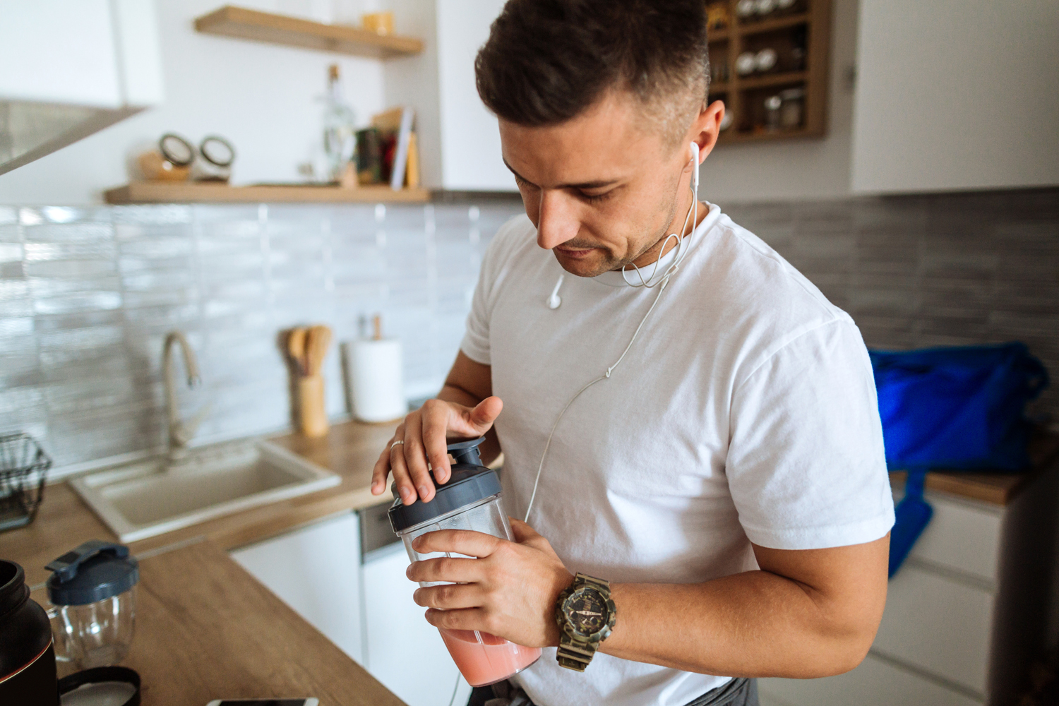 Man making a protein shake.
