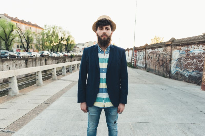 Portrait of man in straw boater by canal
