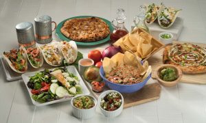 Various Mexican food on a table.