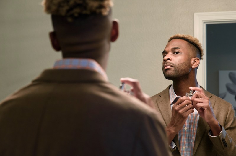 Man applying aftershave