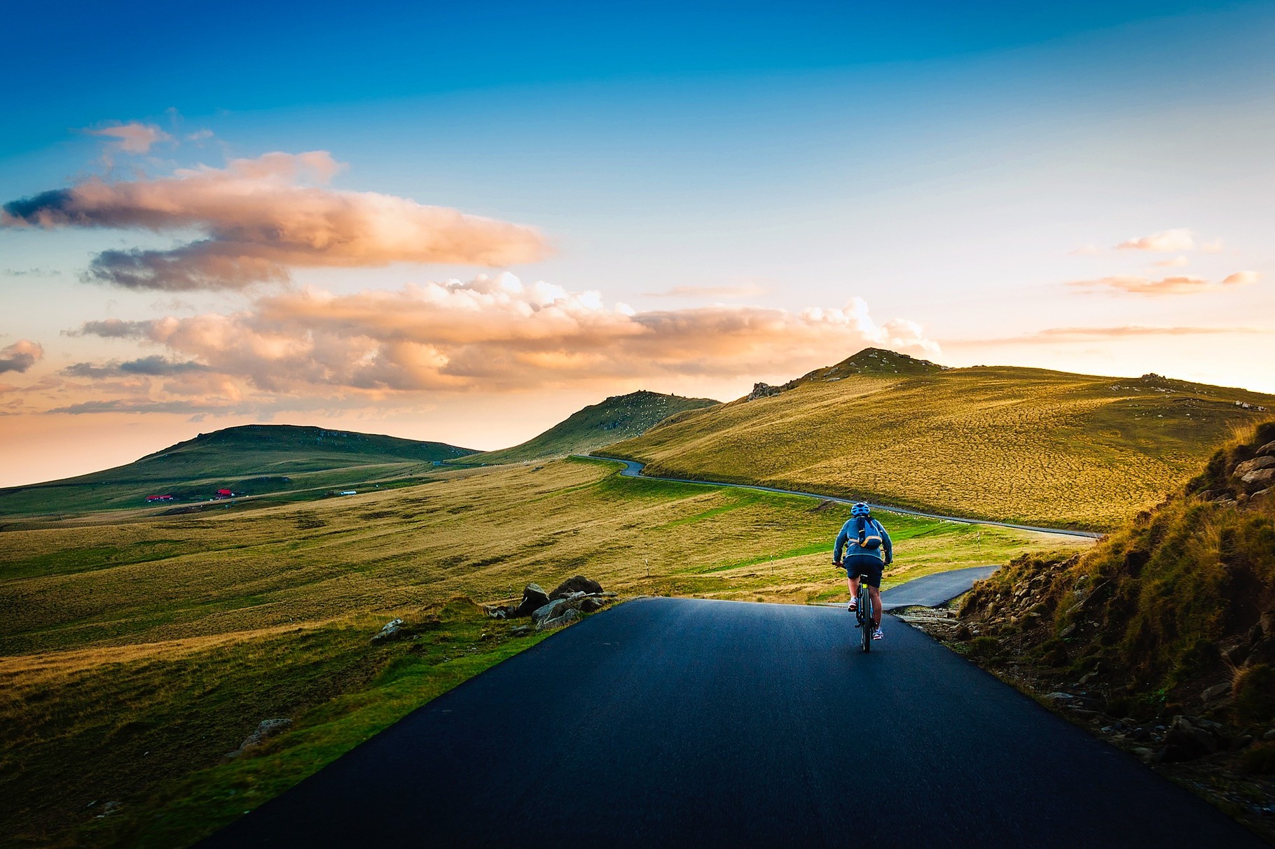 Man cycling on paved path