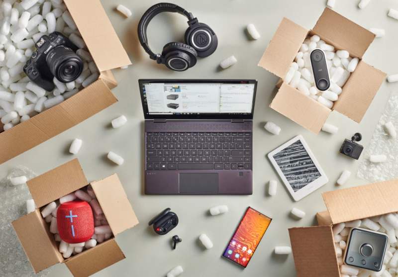 A grouping of opened delivery packages and electronics products.
