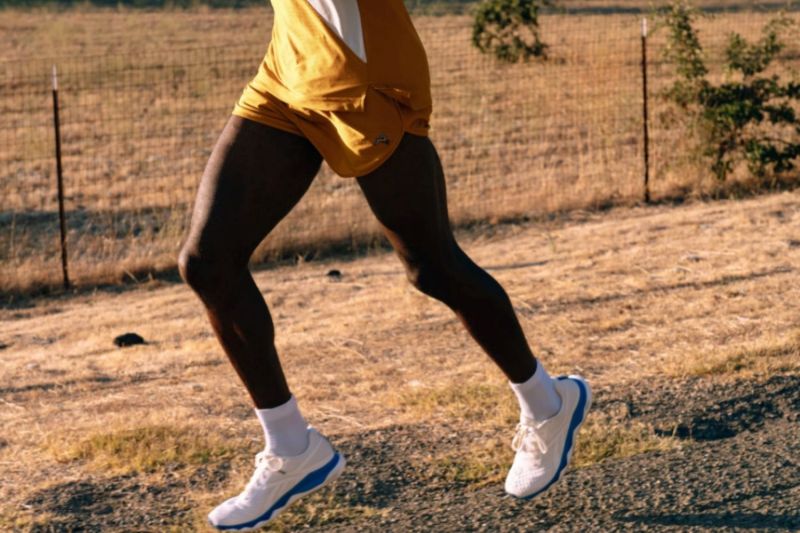 A figure running with Baleaf Running Shorts.