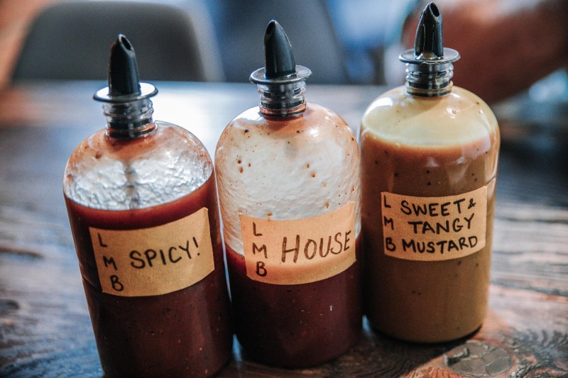 three bottles of BBQ sauce