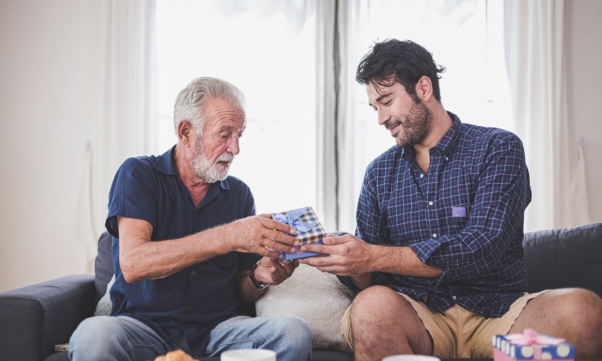 Son giving his dad a gift
