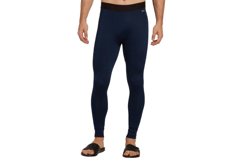 Lower half of a man modeling DSG Men's Cold Weather Compression Tights.