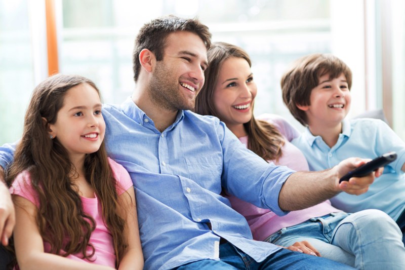 Family watching TV together