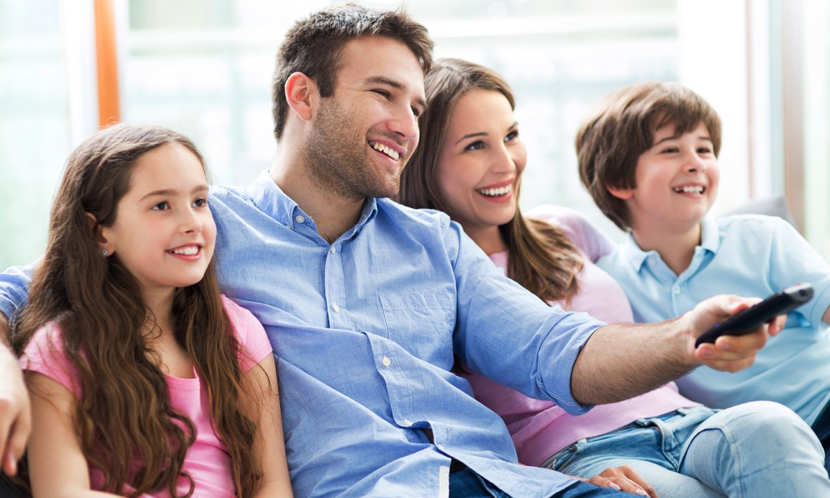 Family watching TV together