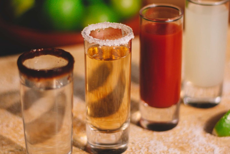 Tequila in shot glasses with lime and salt