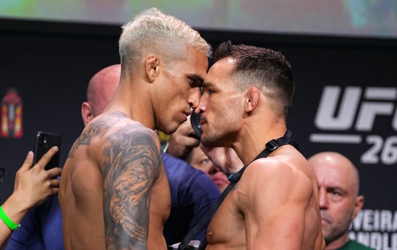 Charles Oliveira and Michael Chandler facing off at a press event for UFC 262.