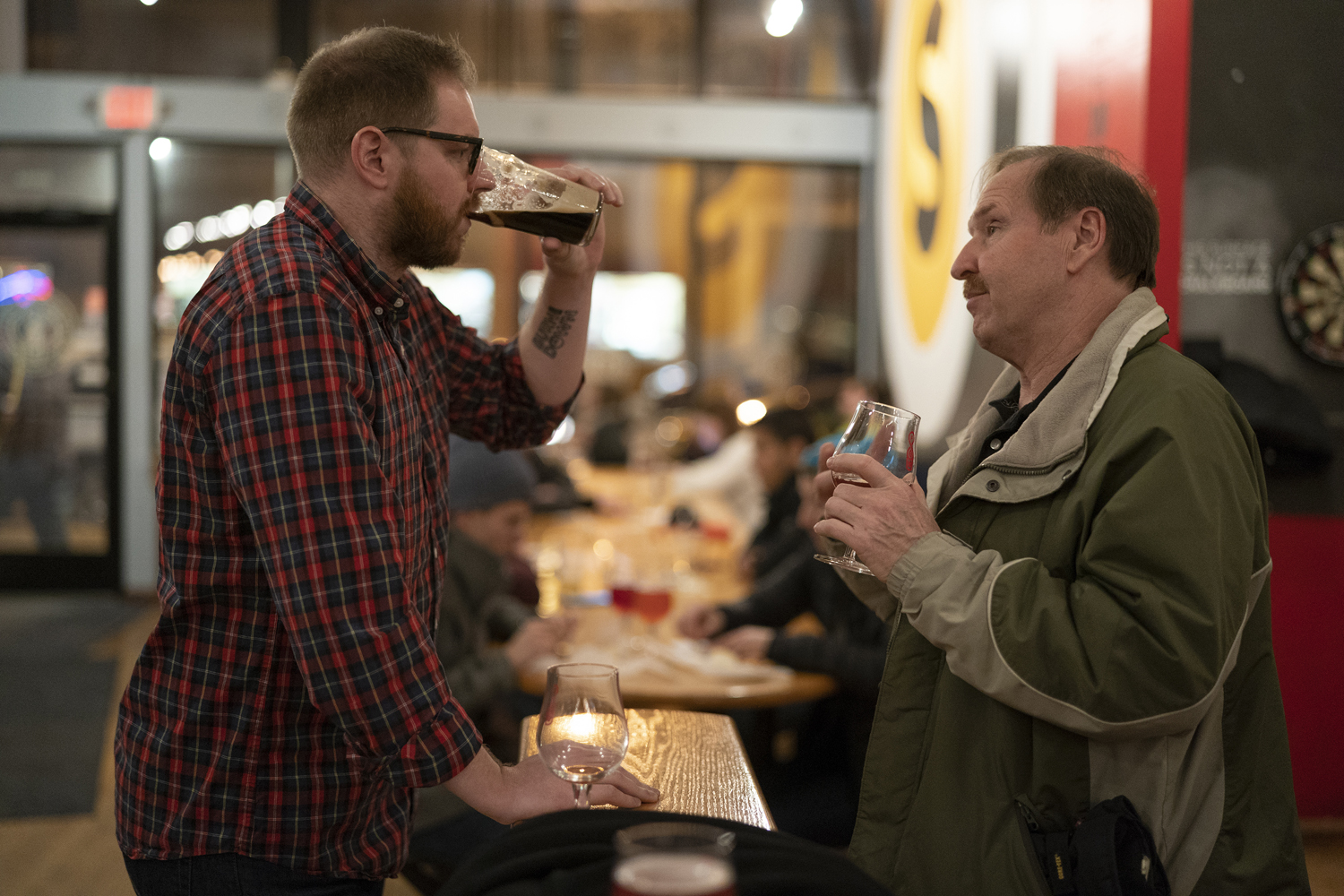 Two men having a drink together.