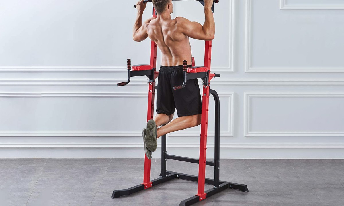Shirtless man exercising at home