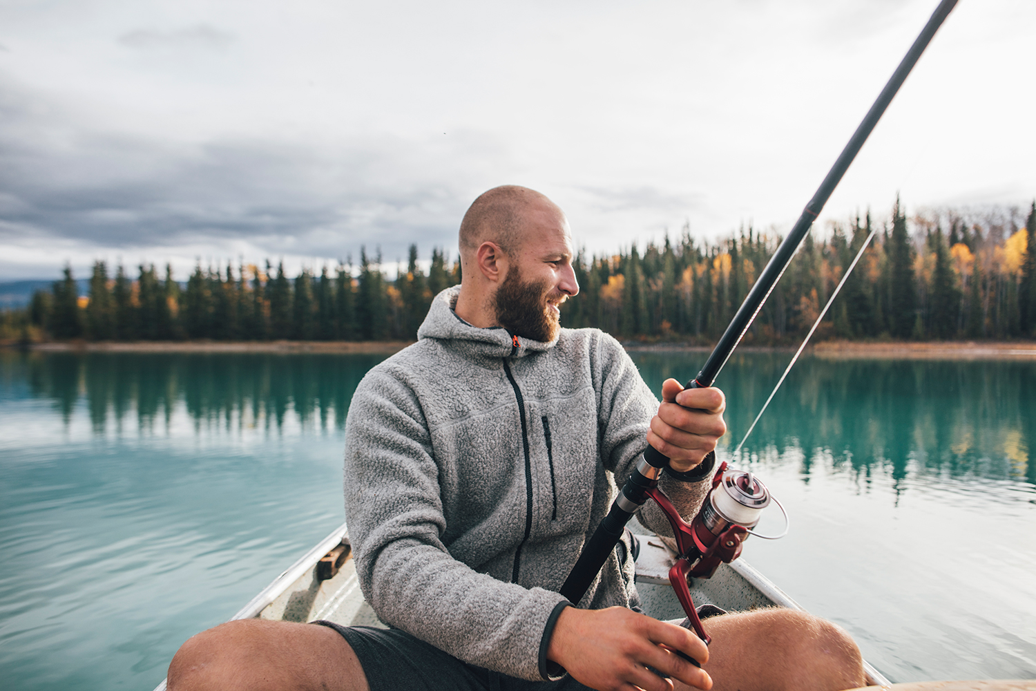 Guy fishing on a lake