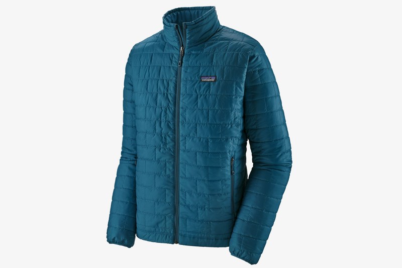 A blue Patagonia primaloft mid layer on a white background.