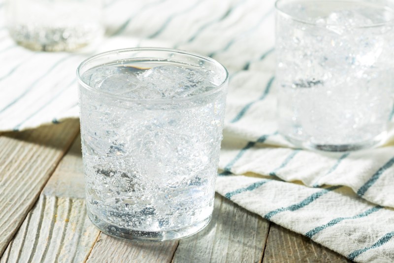 A glass filled with sparkling water.