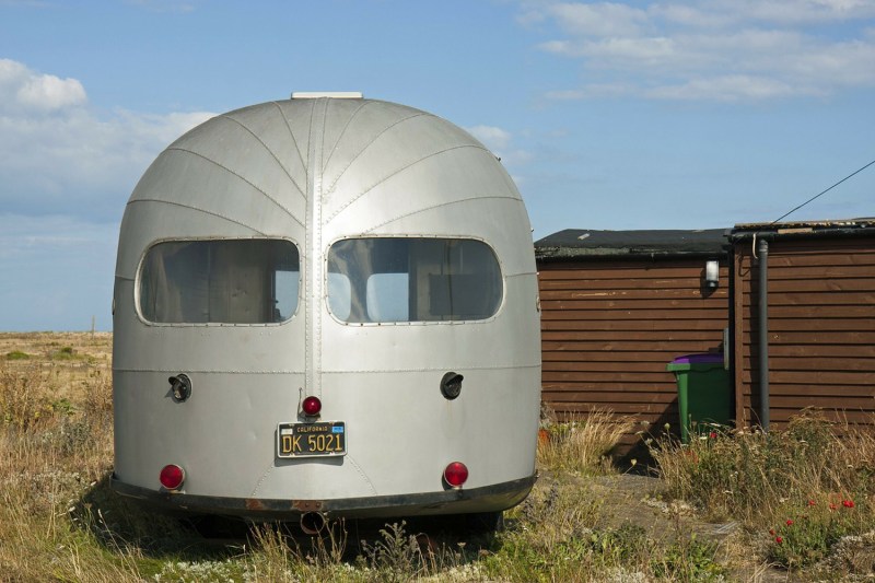 An airstream trailer on the field.