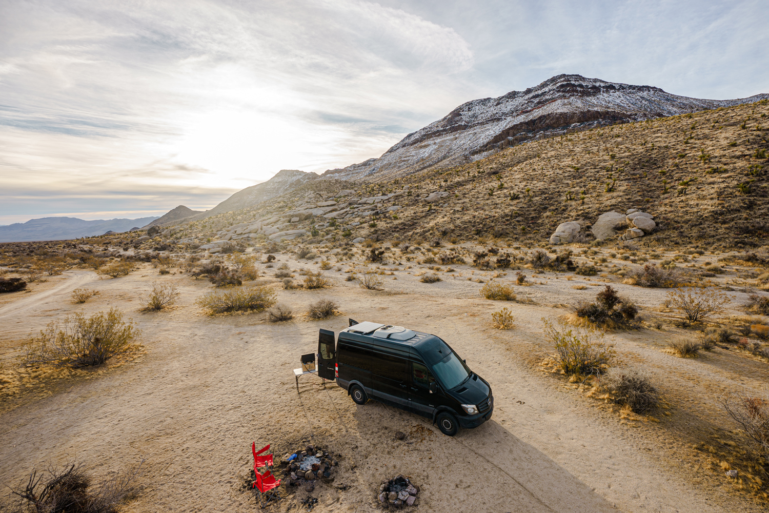 A bird's eye view of the converted Sprinter campervan parked in the Mojave National Preserve.