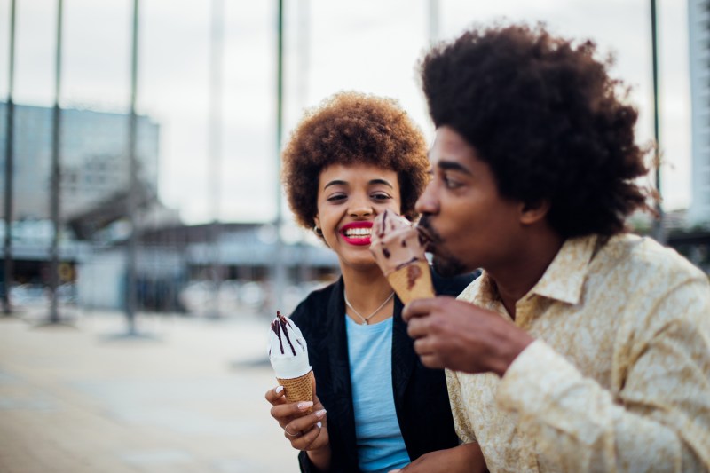 Happy couple enjoying ice cream
