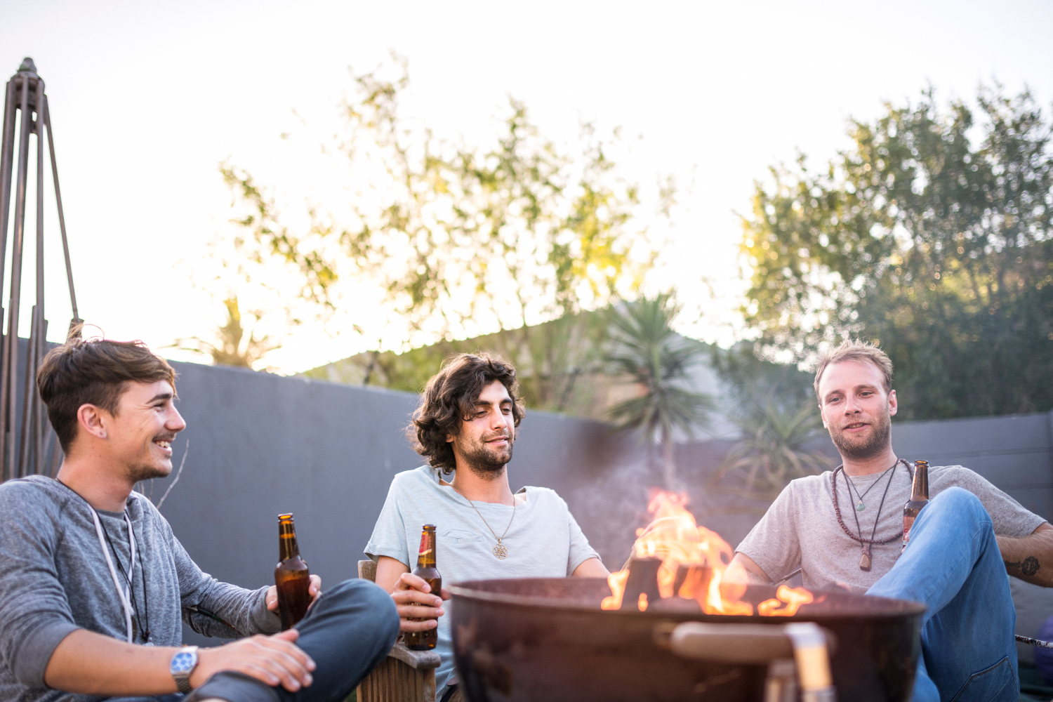 Friends garthered around a fire pit