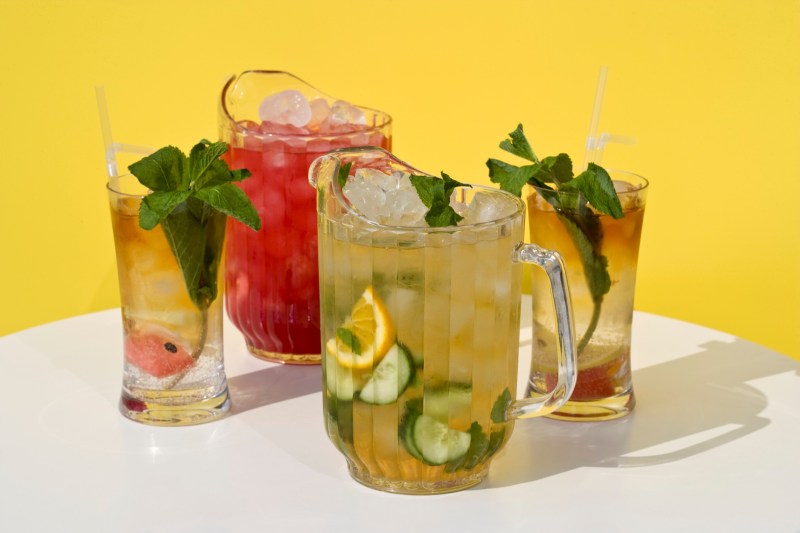 Pimm's cocktails in glasses and jugs.