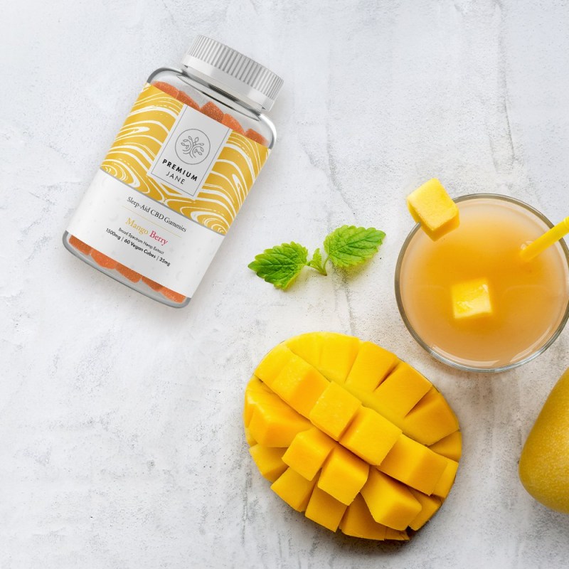 Premium Jane Mango Berry CBD Gummies with cut-up mango fruit.