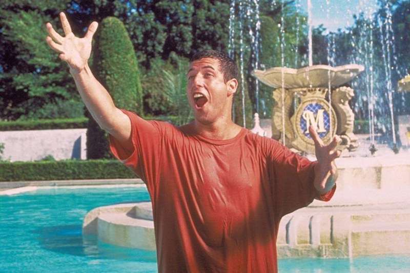 Sandler sings to the heavens after having a forced epiphany. 