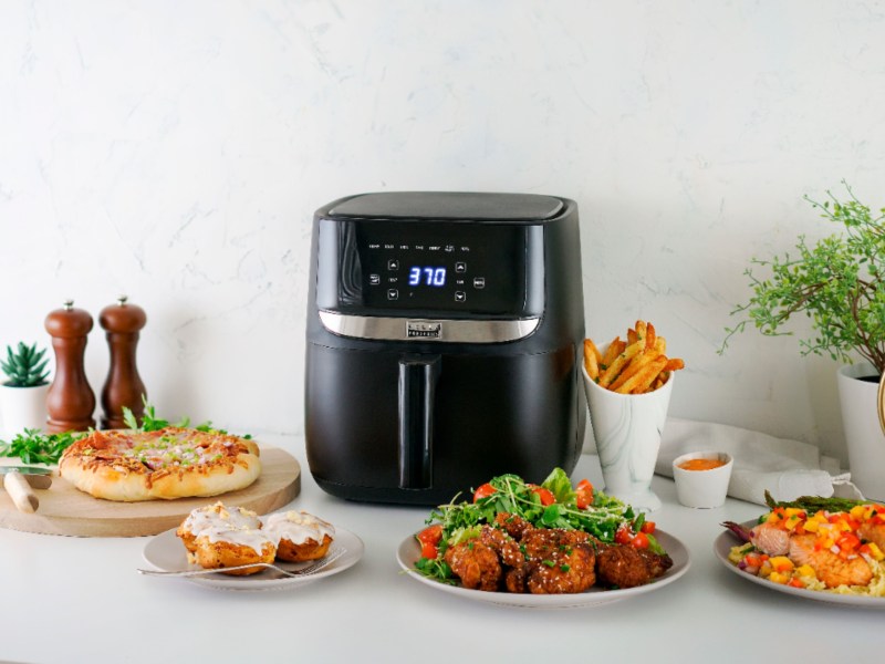 Bella Pro Series 6 QT air fryer on the counter with prepared food.