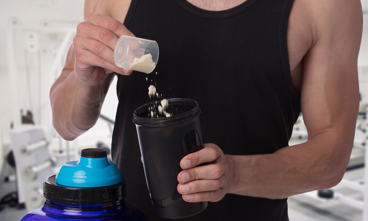 Man put whey protein in shaker