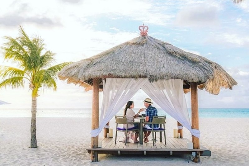 Couple in a beach hut at Bucuti & Tara Beach Resort.