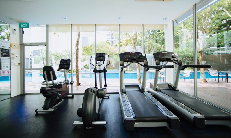 Ellptical, treadmill, and bike at a gym.