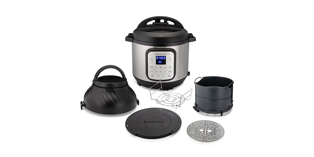 Instant Pot 6-quart Duo Crisp with accessories lined up around it on a white background.