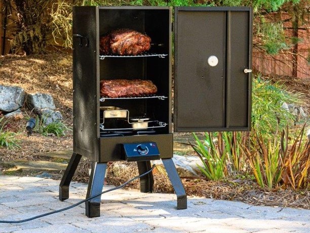 Masterbuilt Analog Electric Smoker with food inside and on the patio.