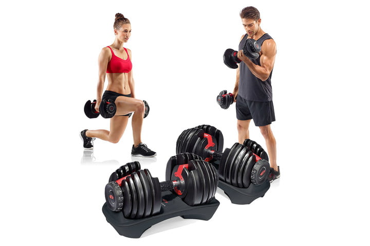 Man and woman using Bowflex ST 552 dumbbells.