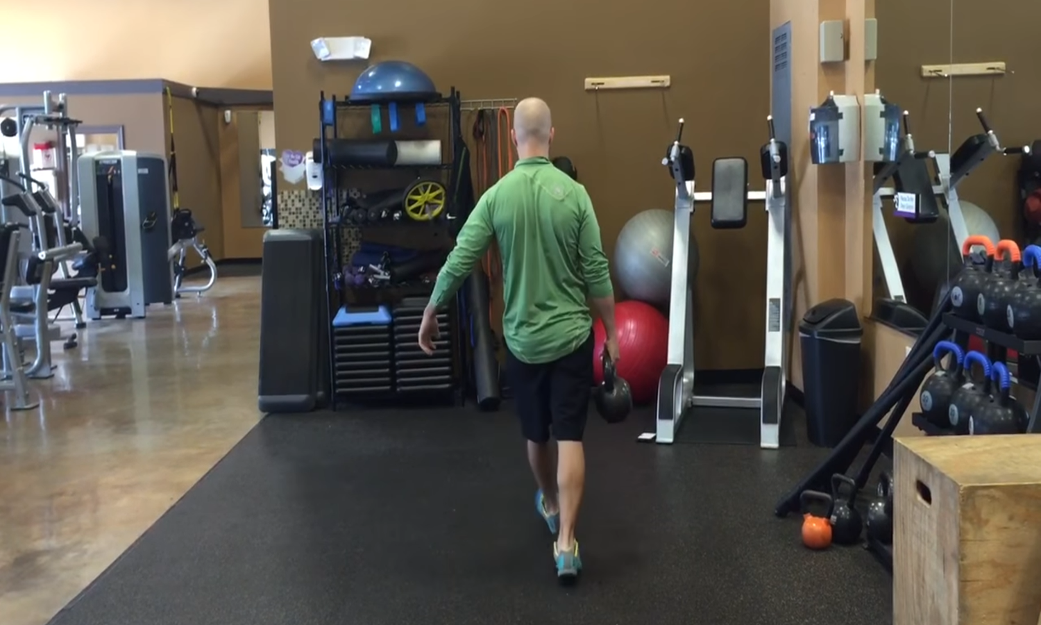 Luke Andrus performing the Single-Arm Farmer’s Carry.