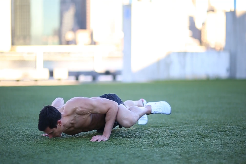 Marc Perry showing how to do a Spider-Man push-up.