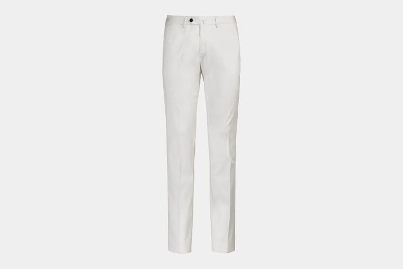 A pair of white Suit Supply trousers.