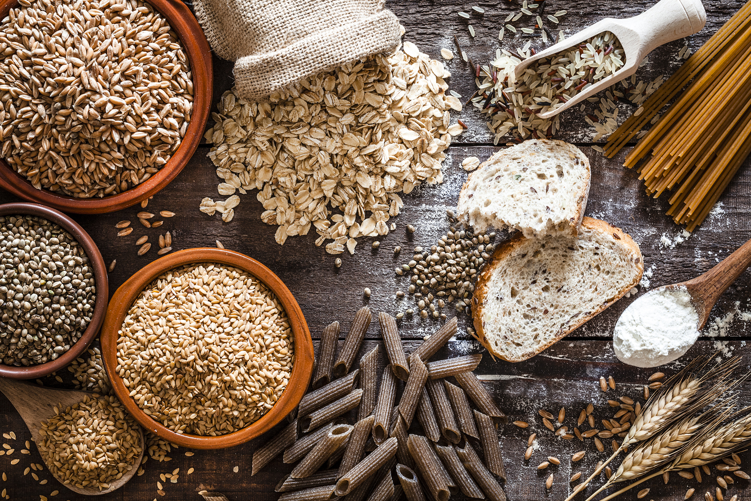 Whole grain food on a wooden table.