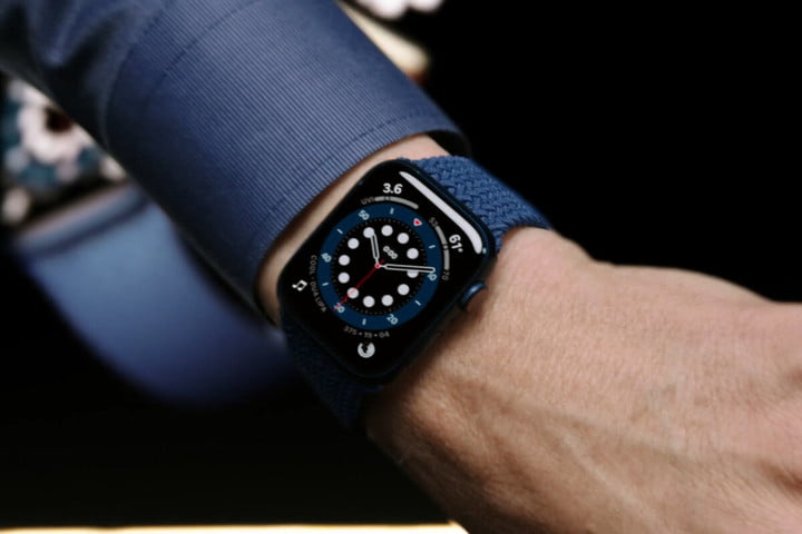 Apple Watch Series 6 worn by distinguished professional in suit.