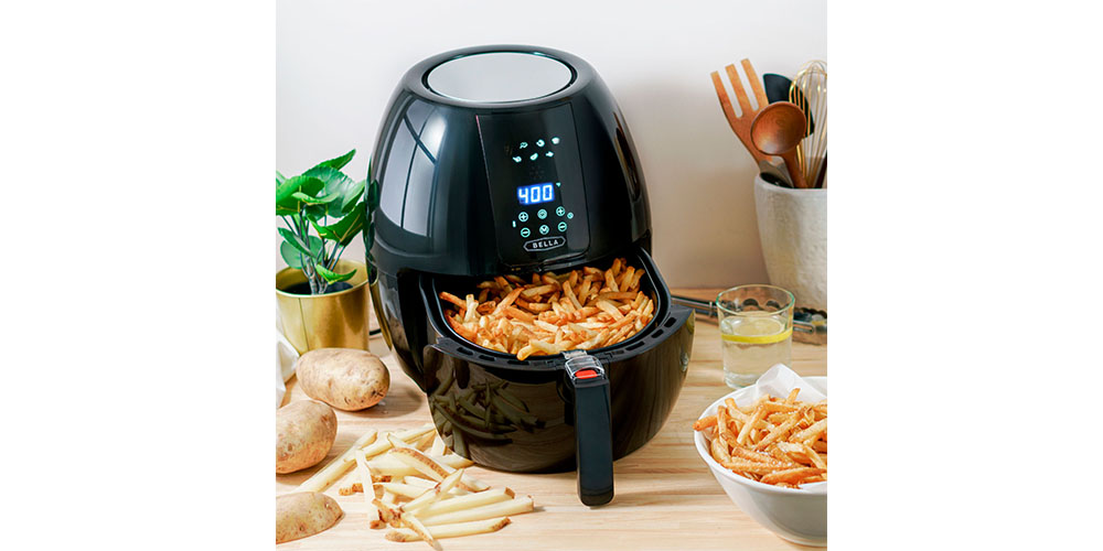 Bella 5.4-quart Air Fryer on a kitchen countertop with fries in the frying container.