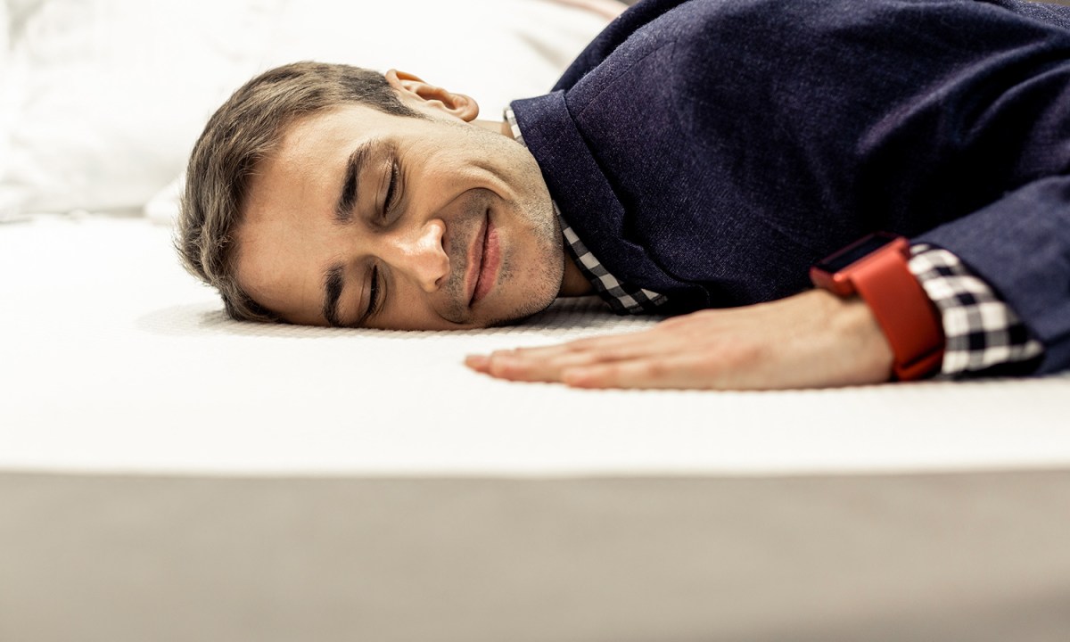 Man sleeping on bed.