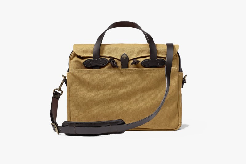 A tan Filson Rugged Twill Original Briefcase.