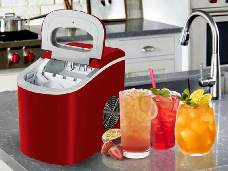 Igloo countertop ice maker in red with adult drinks.