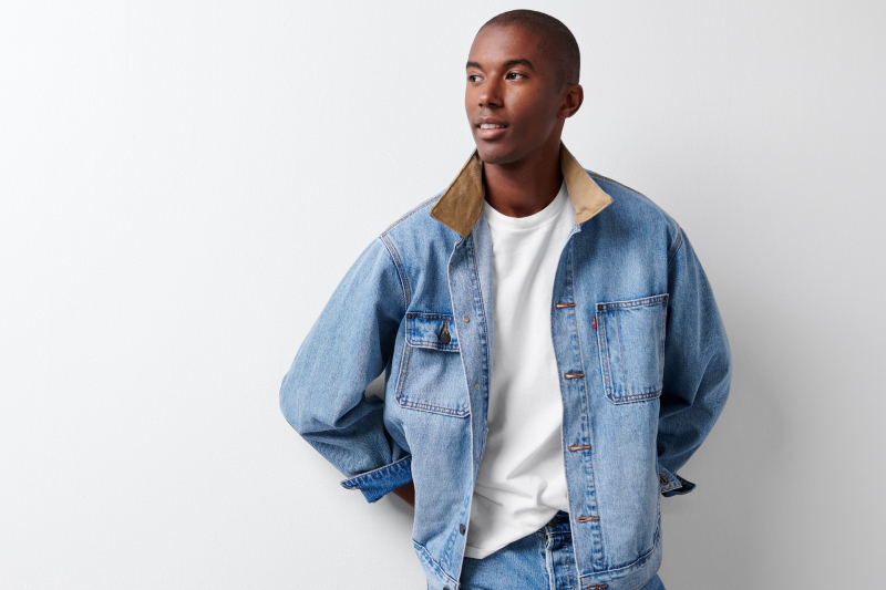 A Stitch denim jacket over white tee and jeans outfit.