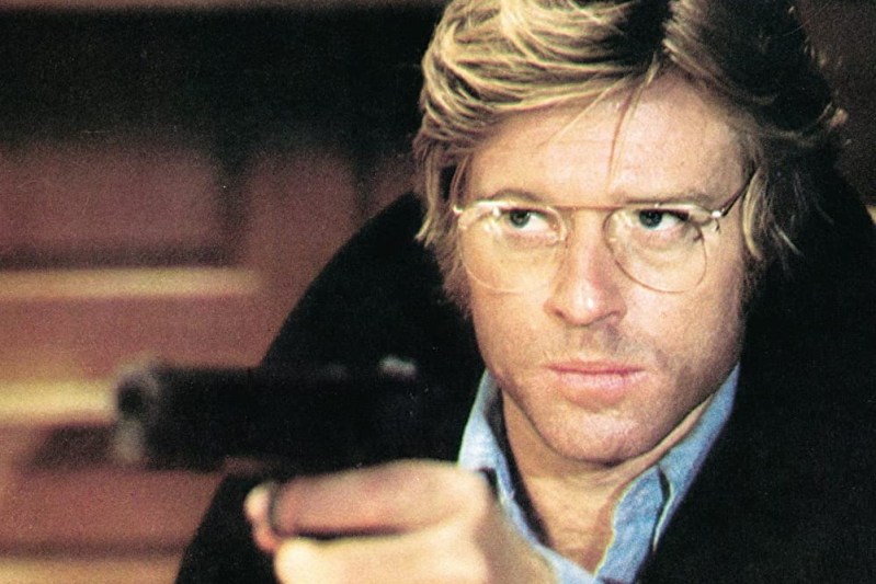 Robert Redford holding a gun in The Three Days of the Condor.