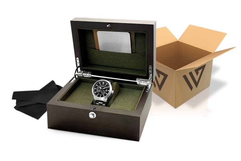 A silver watch in a wooden box