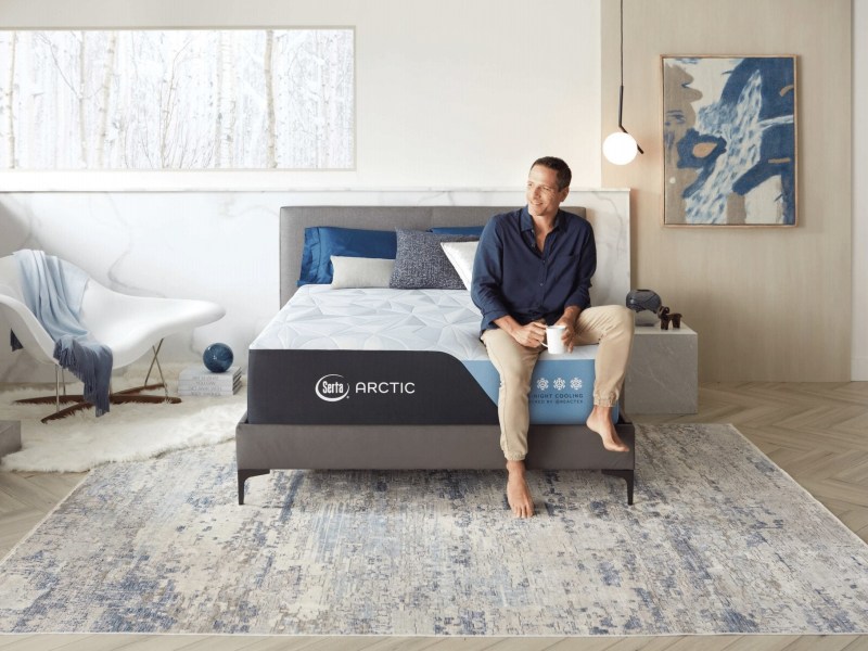 Arctic Premier mattress with man sitting on top.