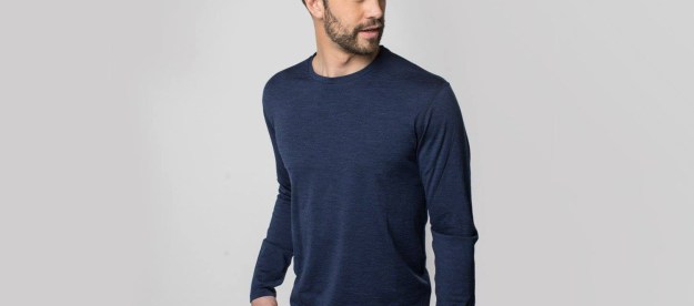 Man wearing merino wool long sleeve shirt.