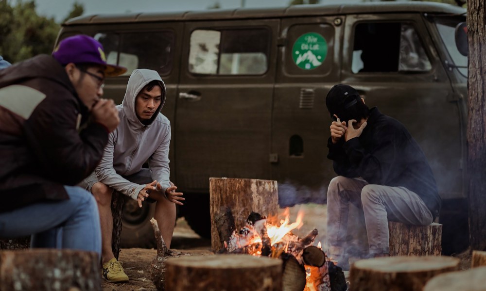 camping in the fall around campfire.